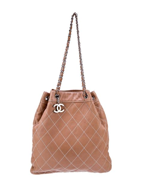 chanel surpique drawstring bucket bag blogger|Chanel Surpique Drawstring Bag .